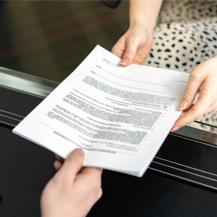 Interviewee handing in a resume